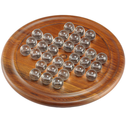 An image of brown solitaire board and clear balls with Jaques London written on them.