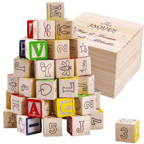 Educational blocks next to wooden storage box