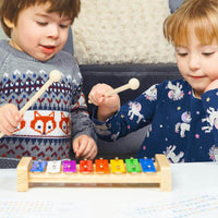 Baby playing sales xylophone